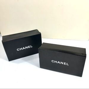 Two black Chanel shoeboxes